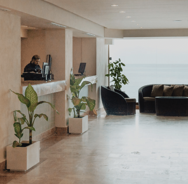 Hotel lobby with modern design and ocean view.