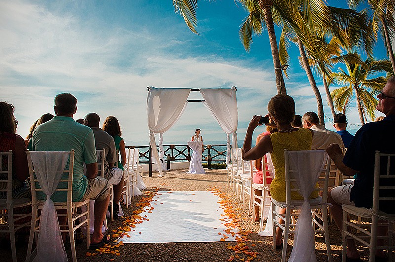 A wedding ceremony waiting for the bride and groom to take their places, guests are waiting for the ceremony.