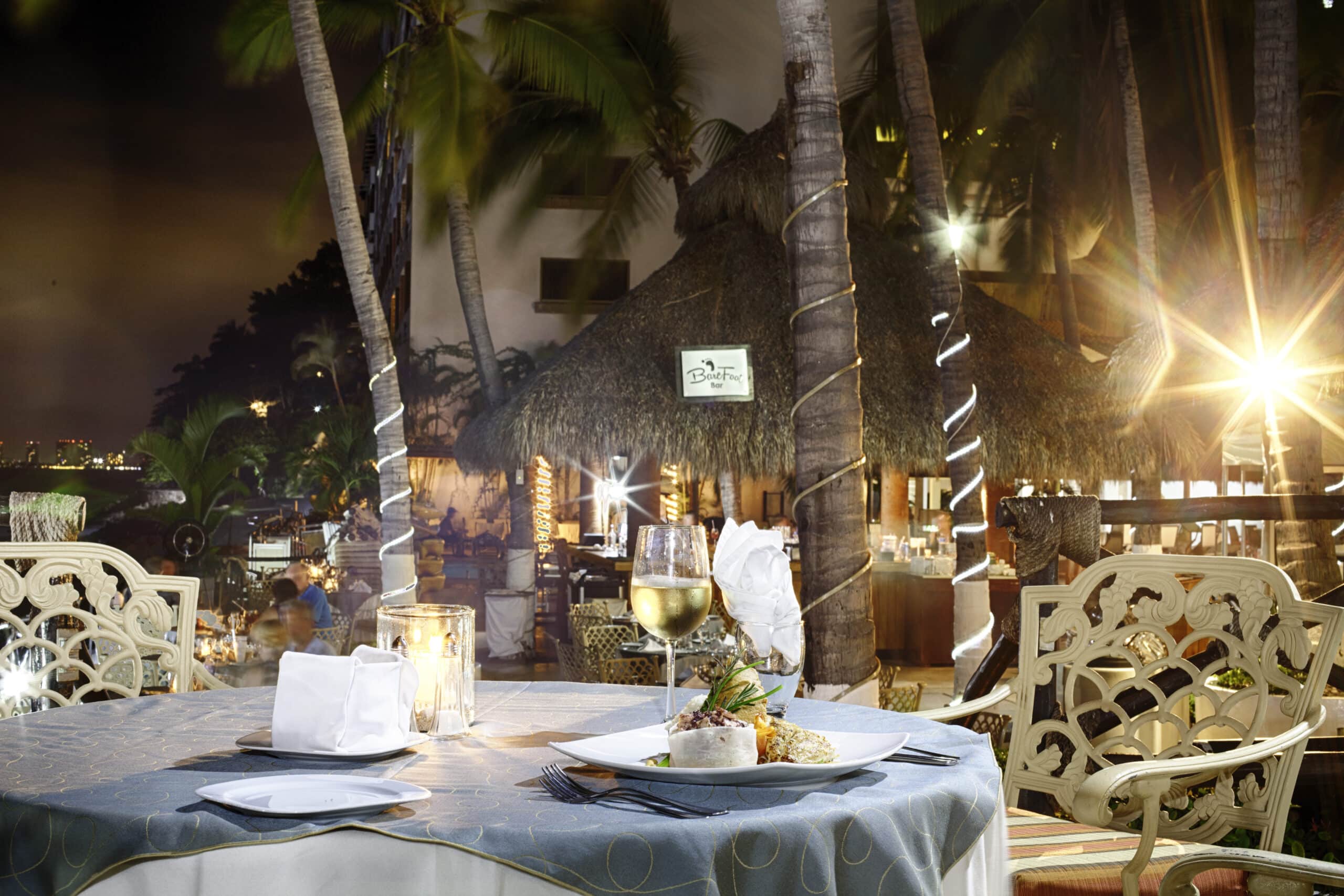 Elegant outdoor dining with a tropical ambiance.